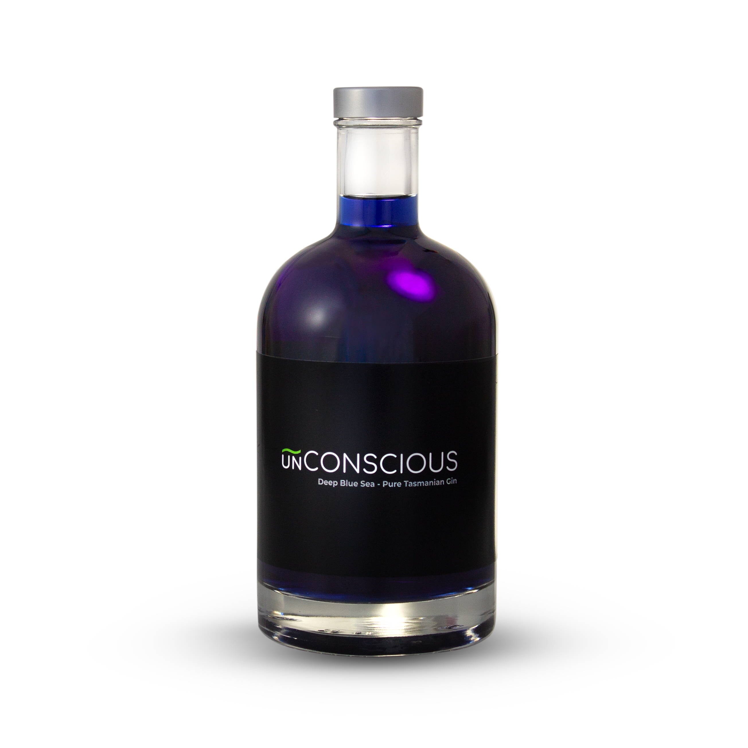 A bottle of Deep Blue Sea gin on a white background. It is a deep blue spirit and clear bottle, with a simple black label that has the logo on it. 